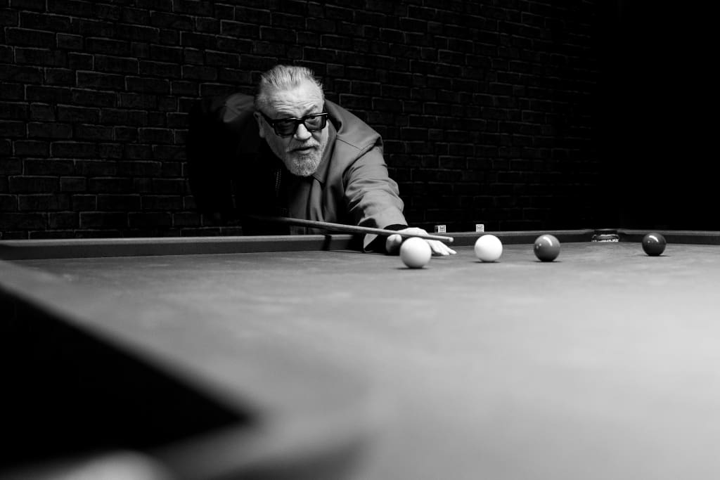 Ray Winstone playing snooker